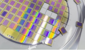 Close-up of a semiconductor wafer with individual microchips.